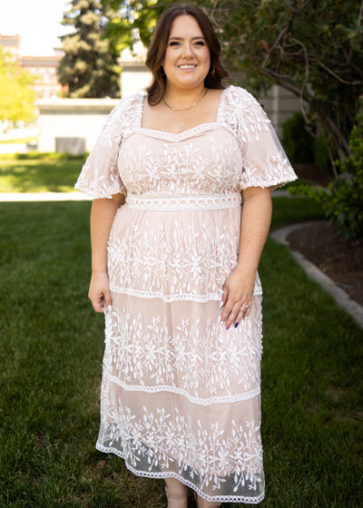 Front view of a short sleeve ivory lace dress