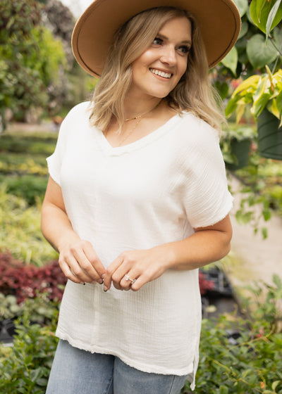 Front view of a white v-neck top