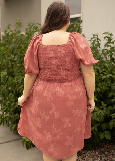 Back view of a plus size dusty rose dress
