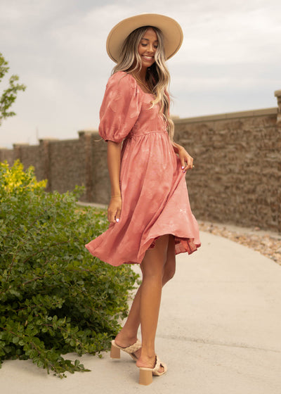 Side view of a dusty rose dress