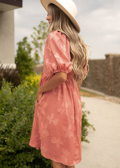 Side view of a short sleeve dusty rose dress