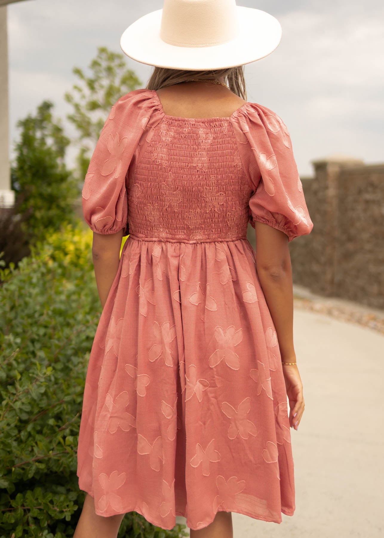 Back view of a dusty rose dress