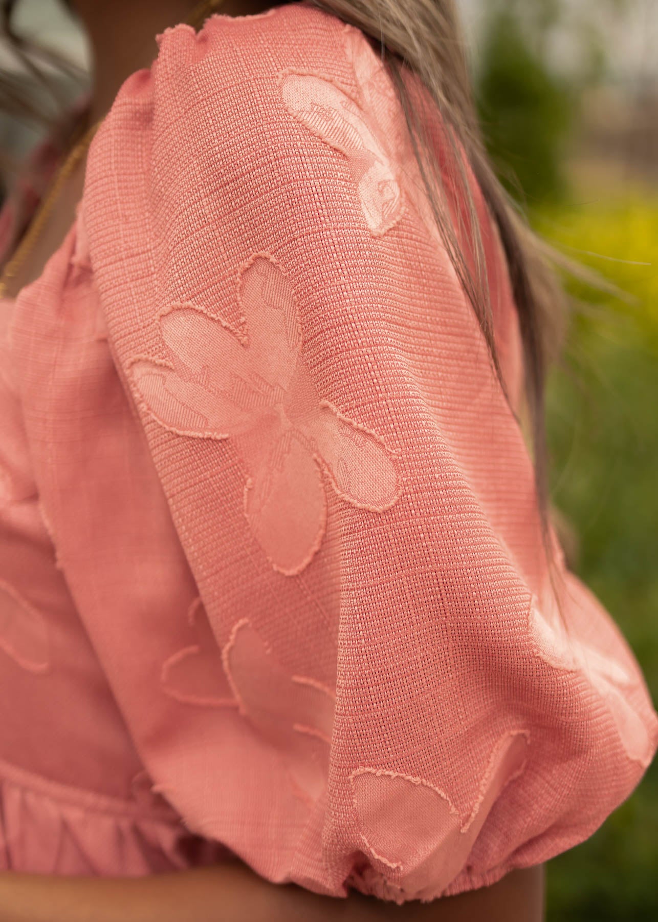 Fabric pattern of a dusty rose dress