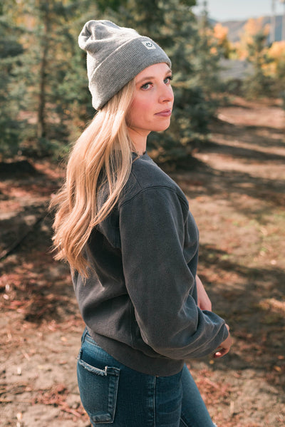 Side view of the deep navy sweatshirt