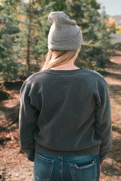 Back view of the deep navy sweatshirt
