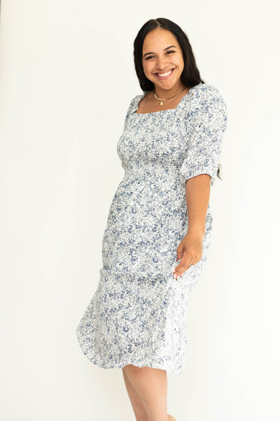 Short sleeve blue and white floral dress with smocked bodice.