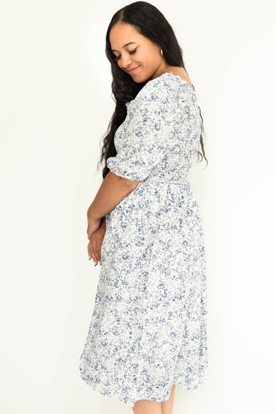 Side view of short sleeve blue floral plus size dress.