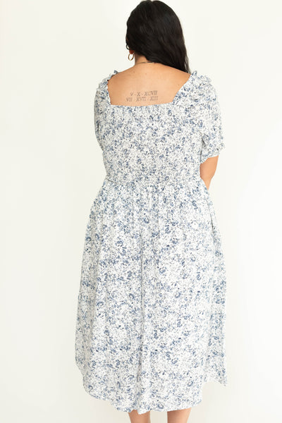 Back view of short sleeve blue floral plus size dress.