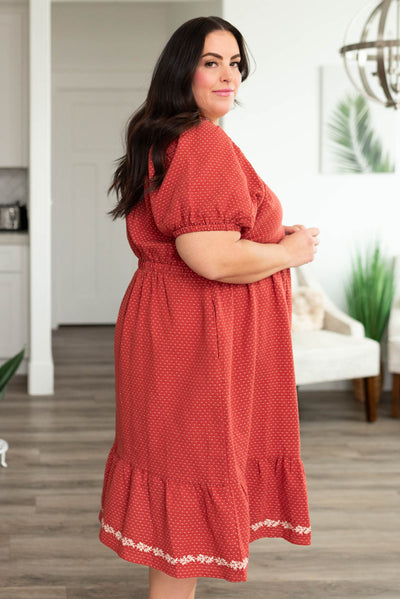 Side view of a plus size red dress