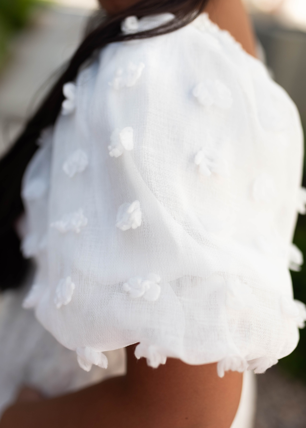 Sleeve of a large white dress