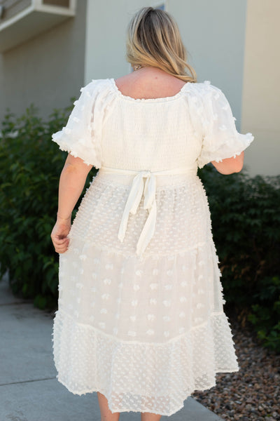 Back view of a plus size white dress