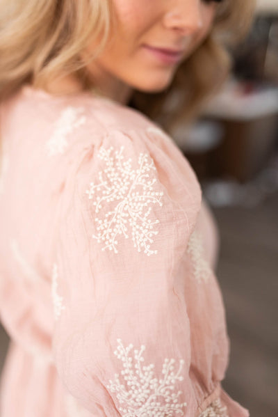 Close up of the fabric on a blush dress