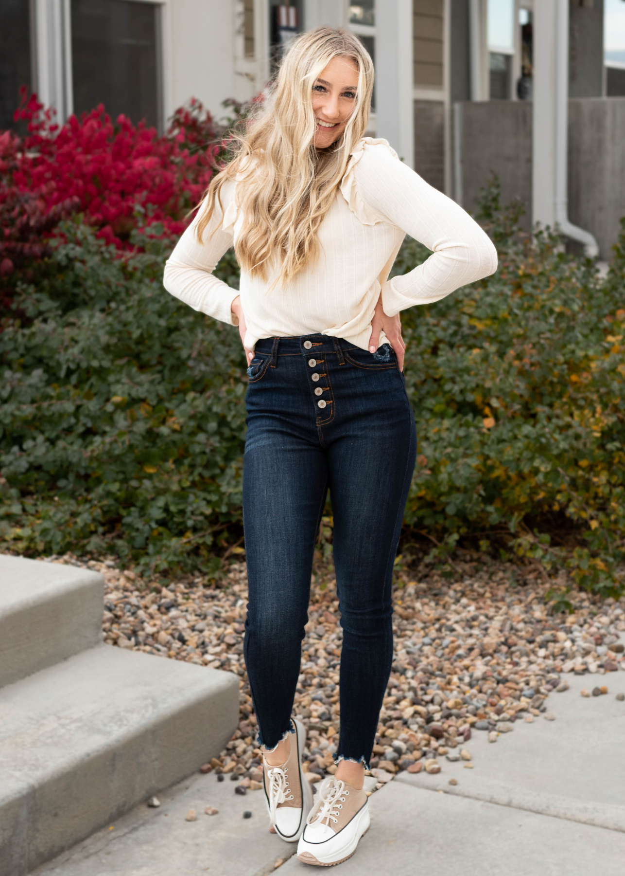 Cream ruffle long sleeve top with ruffle at the shoulder