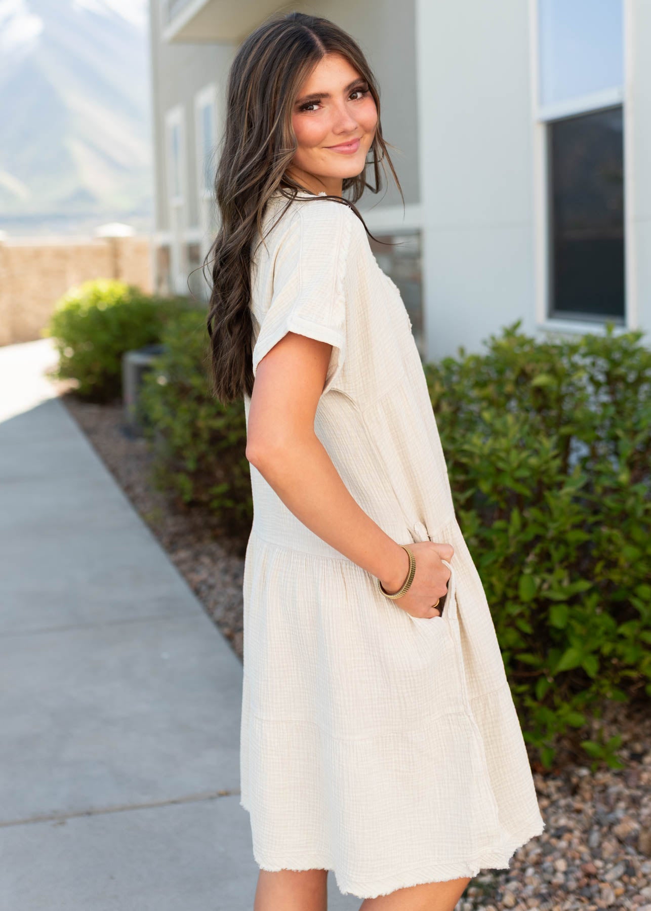 Side view of the beige tiered dress