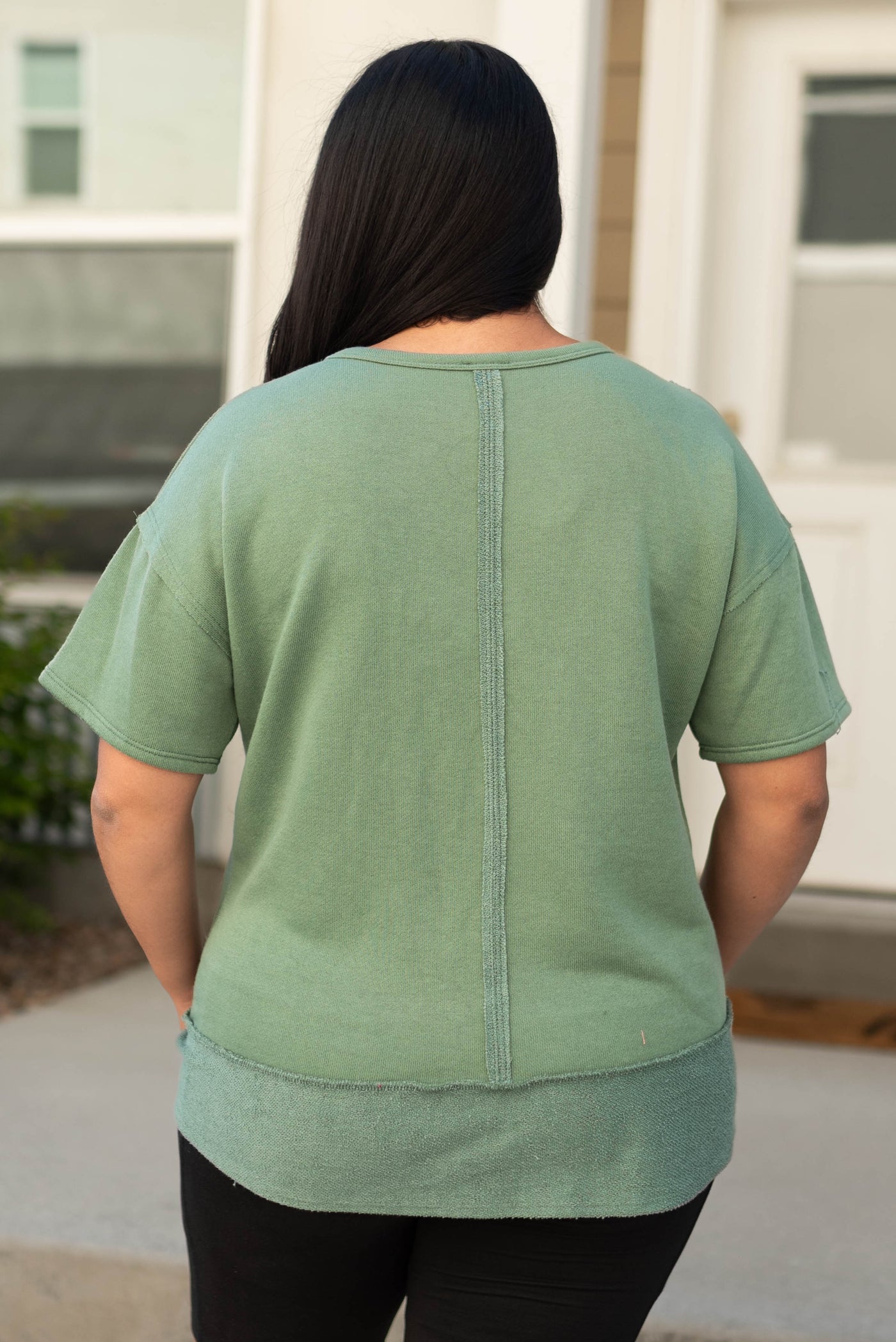 Back view of a olive top