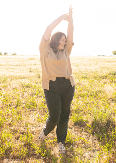 Plus size taupe top with black pants that are sold separately