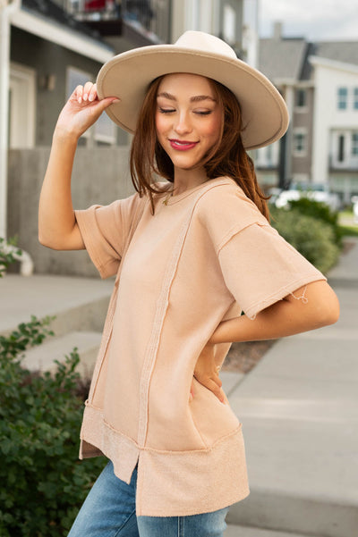 Side view of a taupe top
