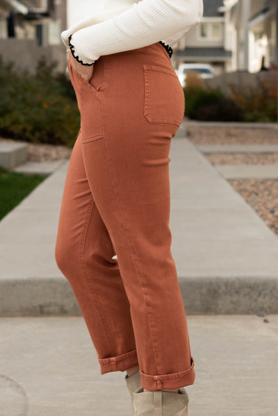 Side view of the washed brown straight pants