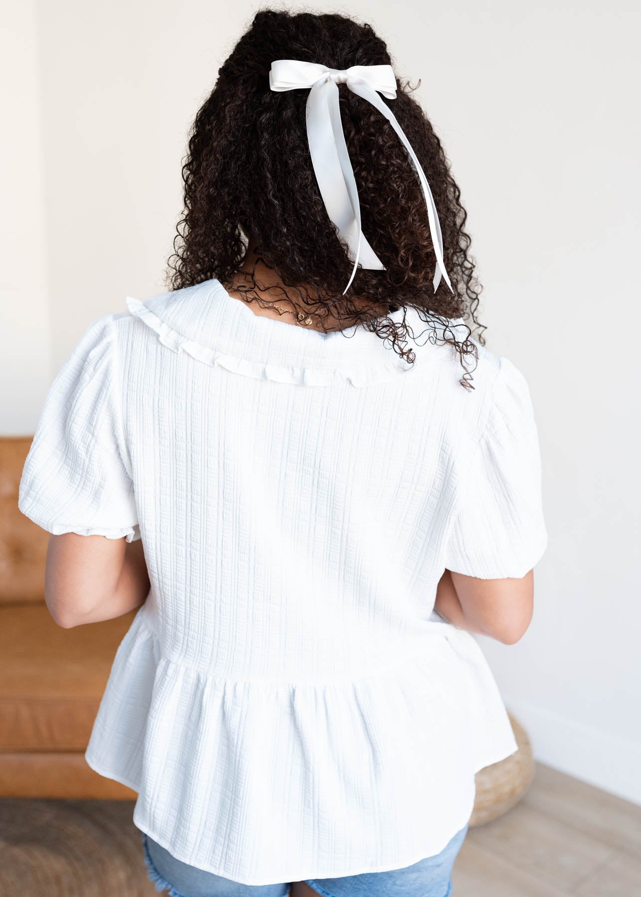 Back view of the white collar top