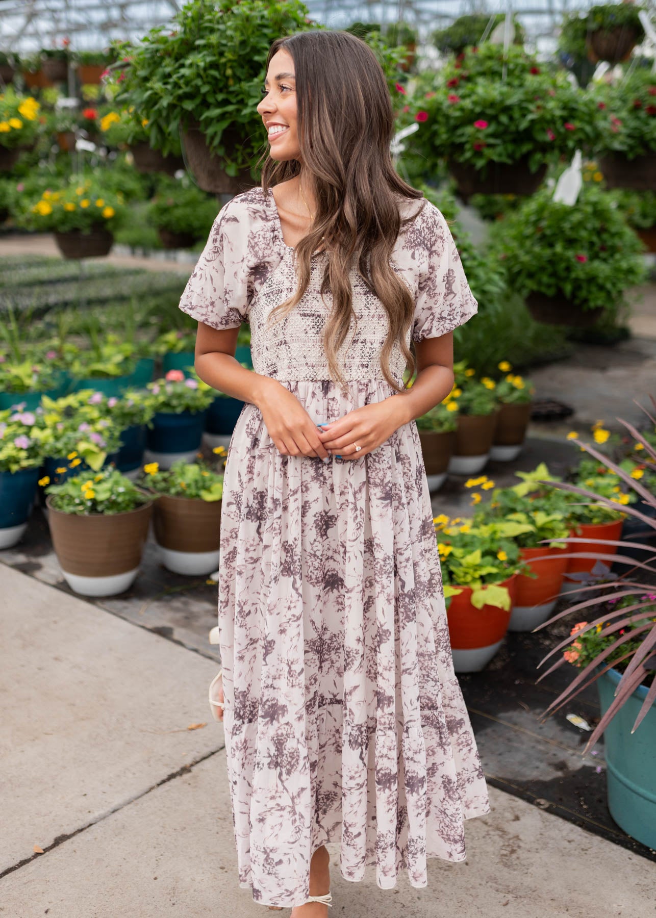 Cream floral smocked dress with embrodery on the bodice