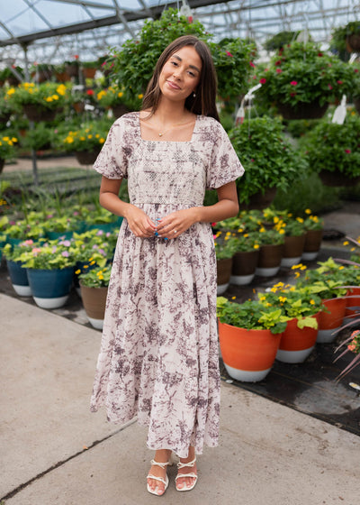 Cream floral smocked dress with short sleeves