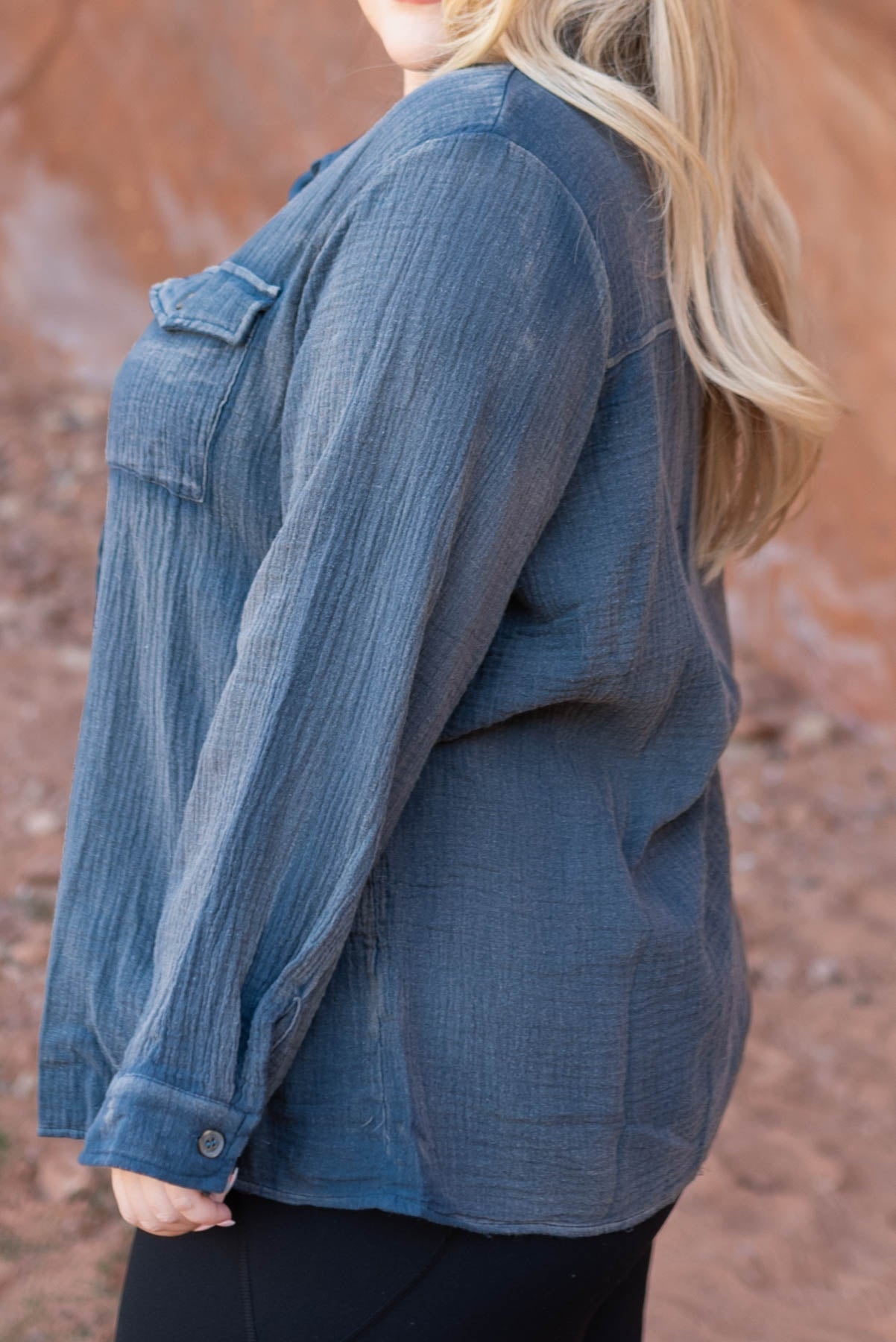 Side view of a plus size blue top