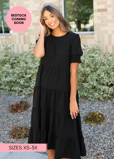 Tiered black dress with short sleeves