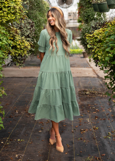 Tiered green dress that is mid length