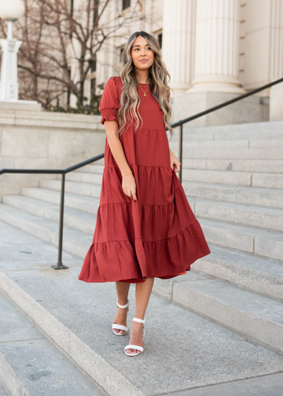 Side view of a tiered rust dress