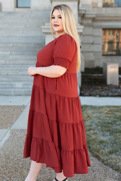 Side view of the plus size tiered rust dress