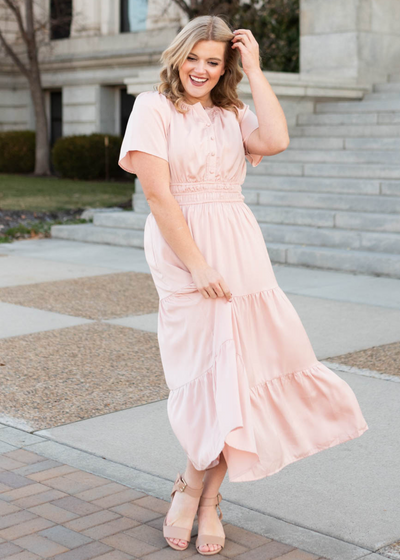Blush tiered dress with short sleeves and buttons on bodice