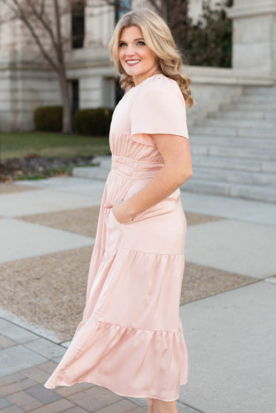 Side view of the blush tiered dress with pockets