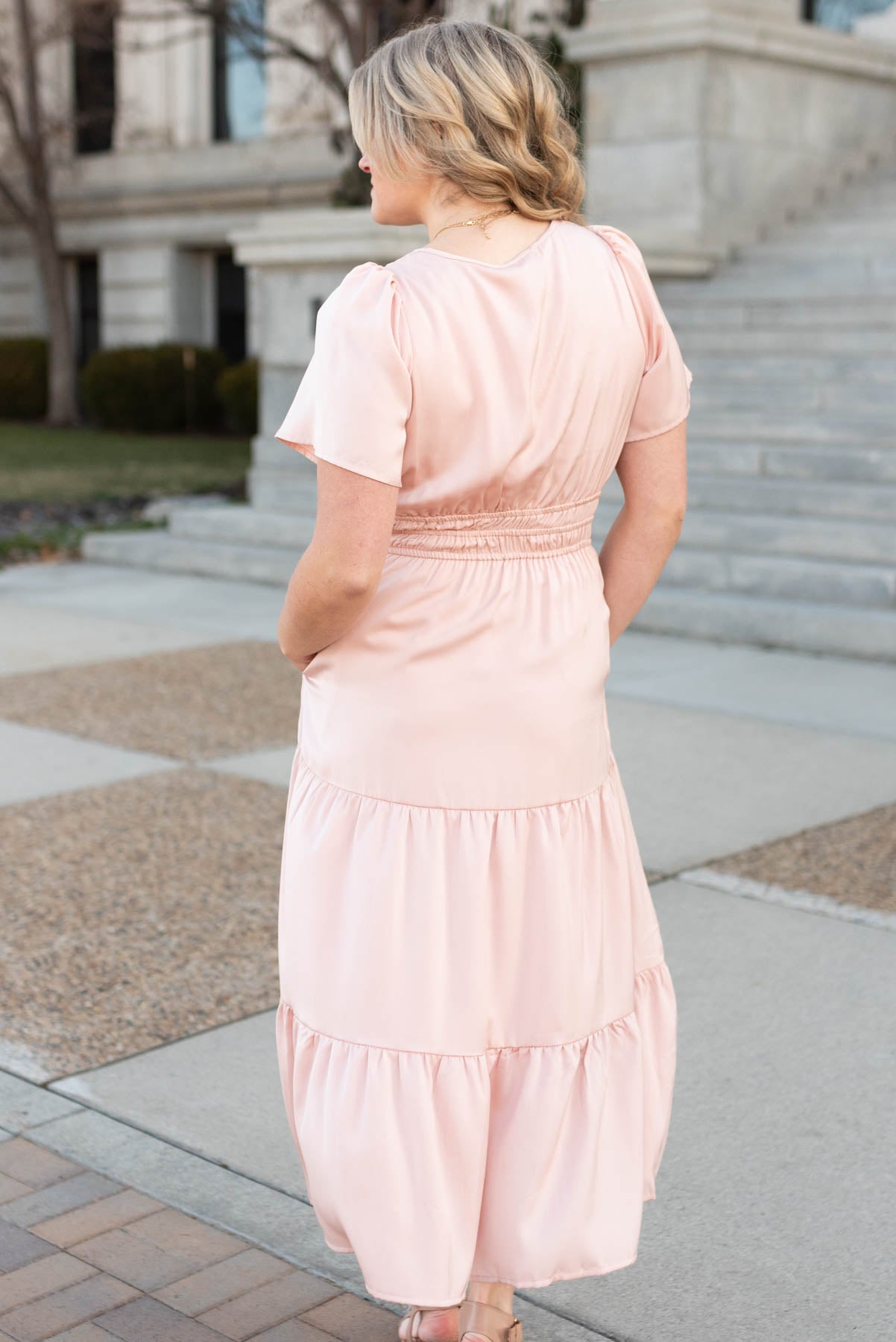 Back view of the blush tiered dress