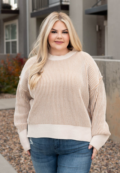 Plus size cream knit sweater with long sleeves and drop shoulder