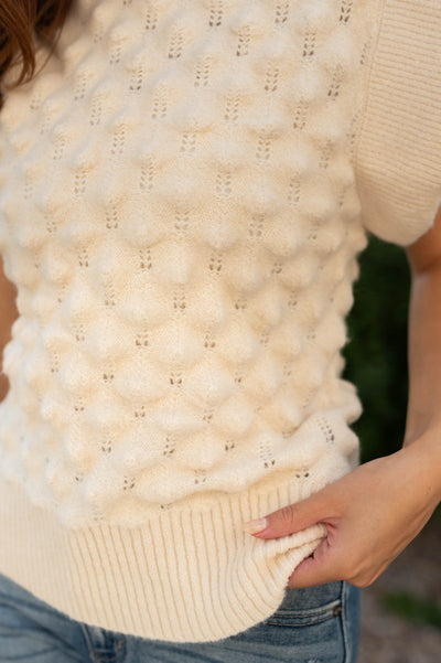 Short sleeve cream top with pattern sweater