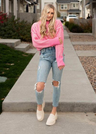 Pink knit sweater with a drop sleeve