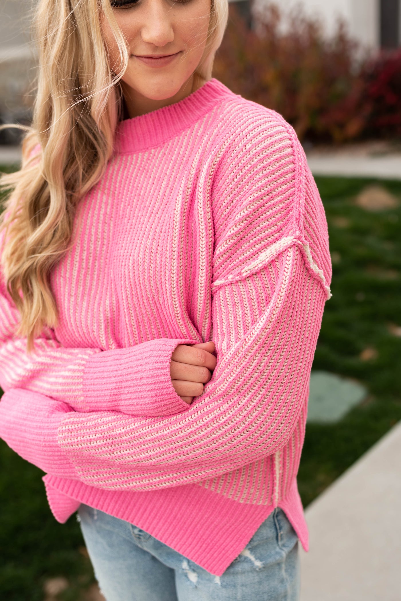 Sleeve view of the pink knit sweater with a drop shoulder