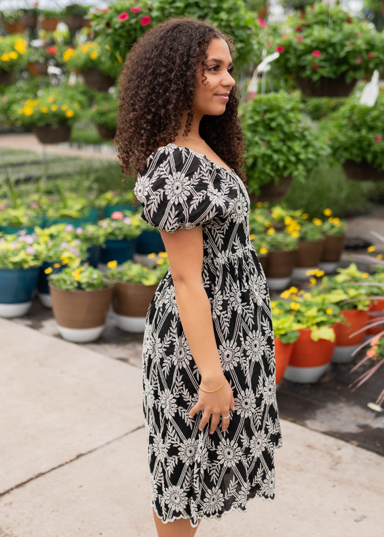 Side view of the black embroidered dress