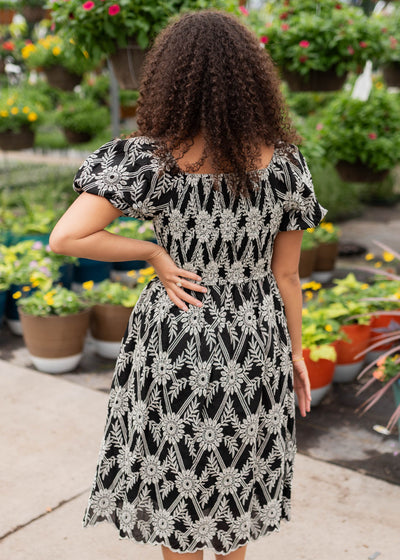 Back view of the black embroidered dress