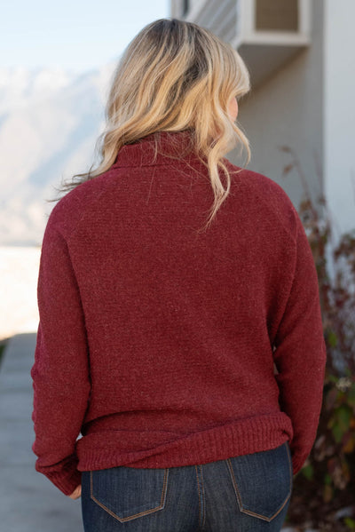 Back view of a burgundy sweater