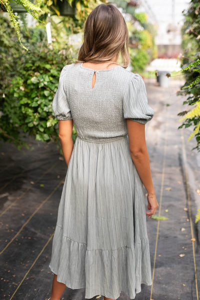 Back view of the dusty blue smocked dress