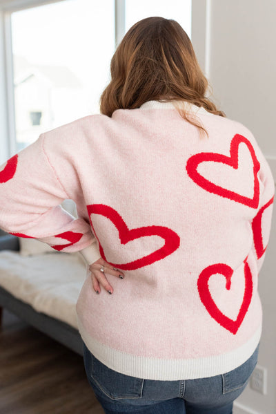 Back view of the plus size red heart sweater