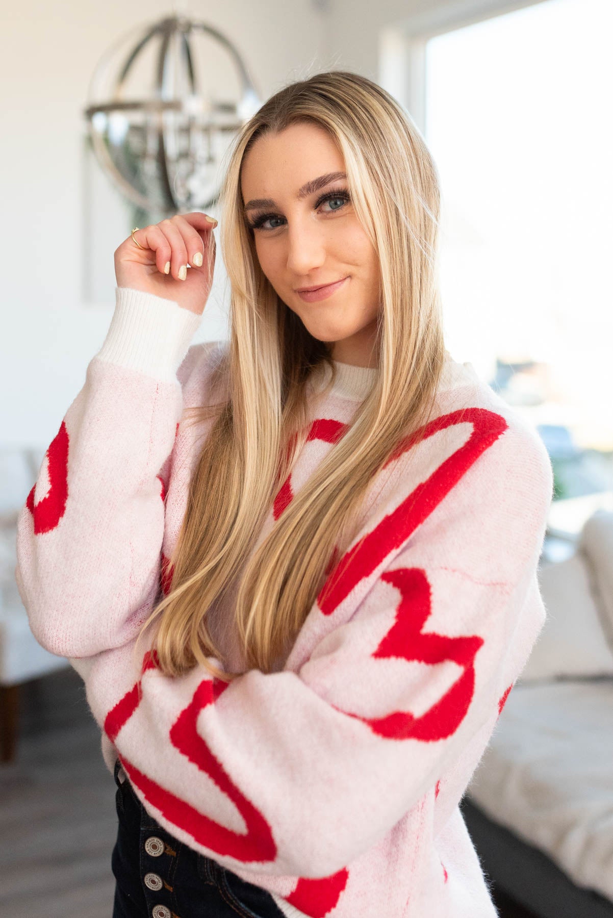 Red heart sweater with white cuffs and neckline