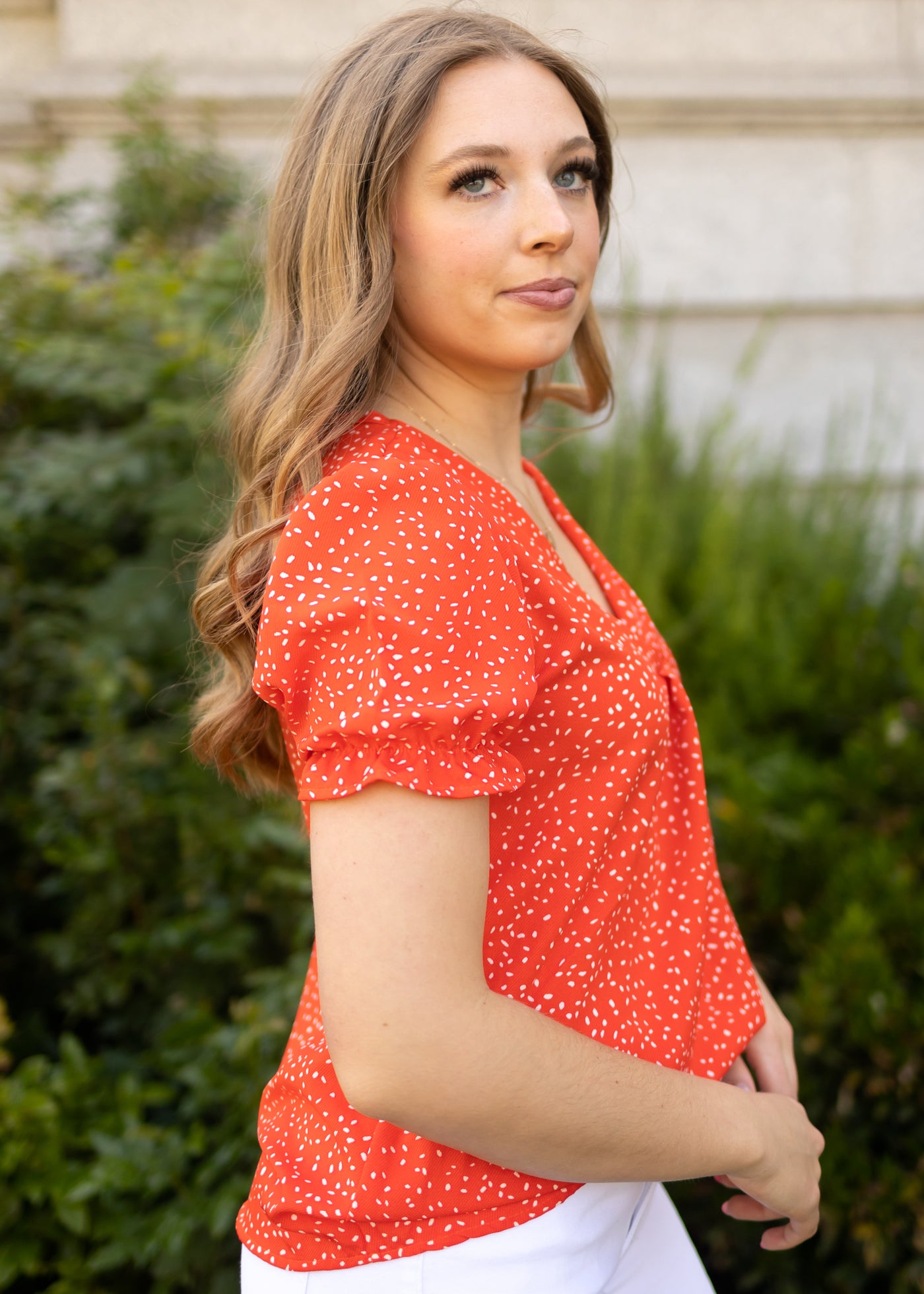 Side view of a short sleeve red top