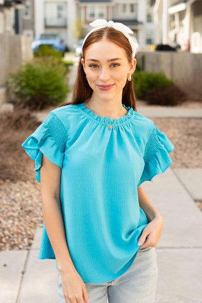 Front view of the turquoise ruffle blouse