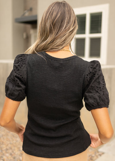 Back view of a black top 