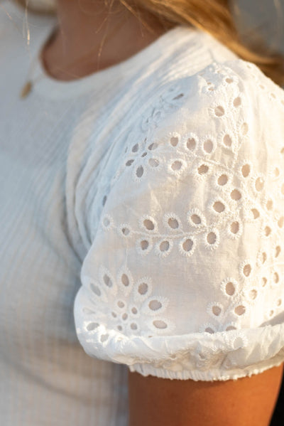 Eyelet sleeve of a ivory top