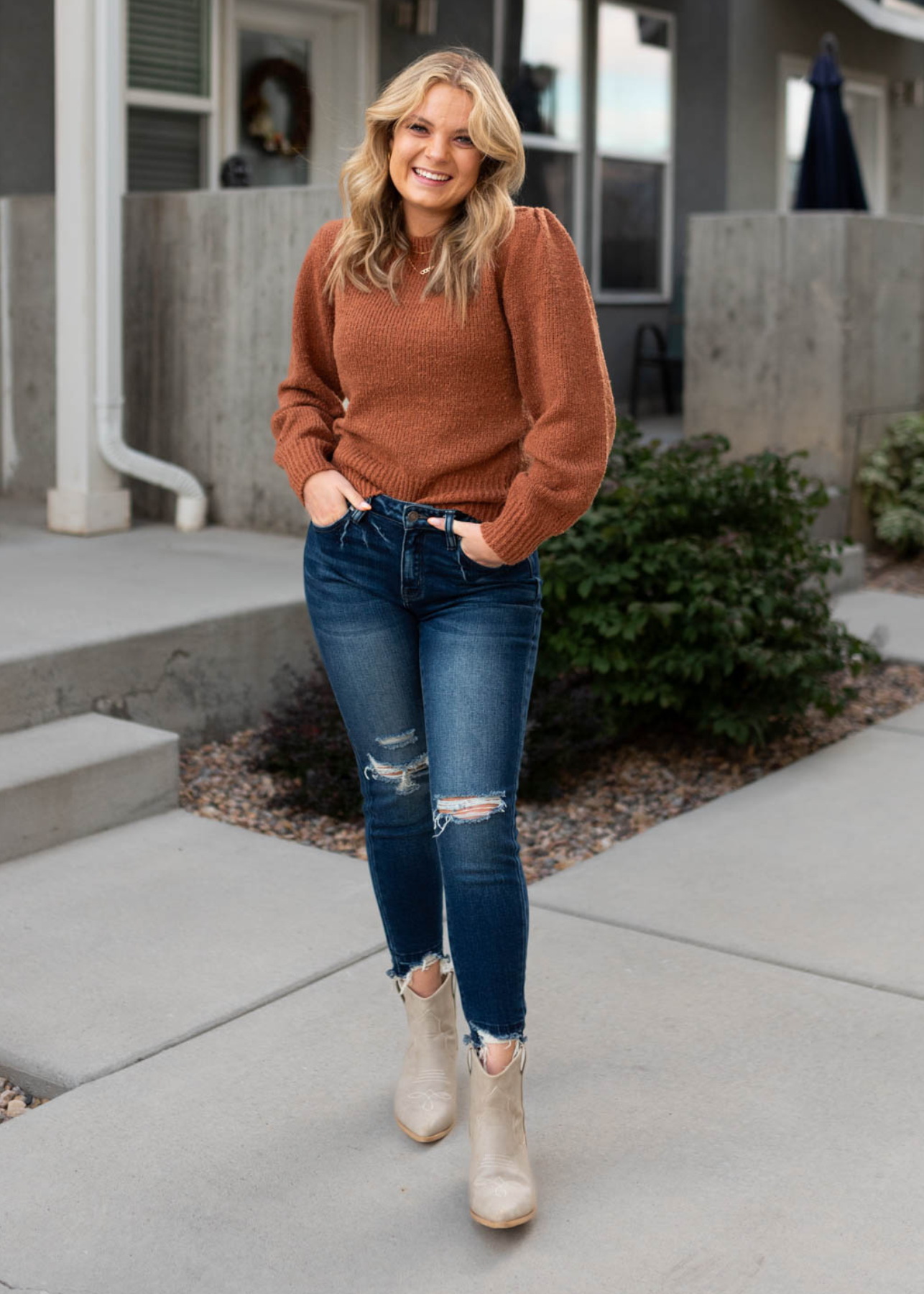 Front view of a camel knit sweater