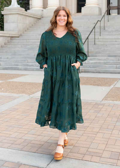 Plus size smocked bodice on the dark green floral dress