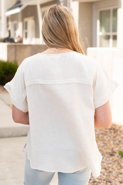 Back view of the cream button top